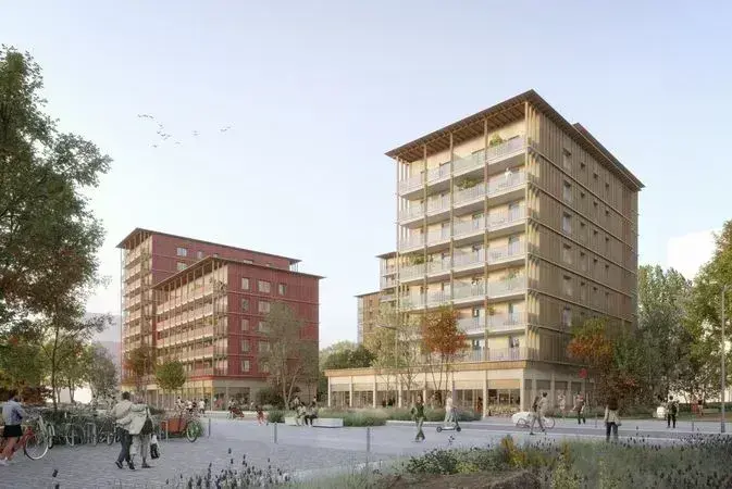 L'îlot A2B, original avec ses façades en paille et ossature bois, comptera 147 logements abordables et sociaux, avec quelques commerces en rez-de-chaussée (supérette, tabac-presse, etc.) et de vastes locaux pour les vélos et vélo-cargo. © NMA - MFLA GHT –